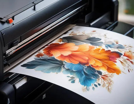 Vibrant floral art print in warm orange and cool blue tones emerging from a high-quality printer.