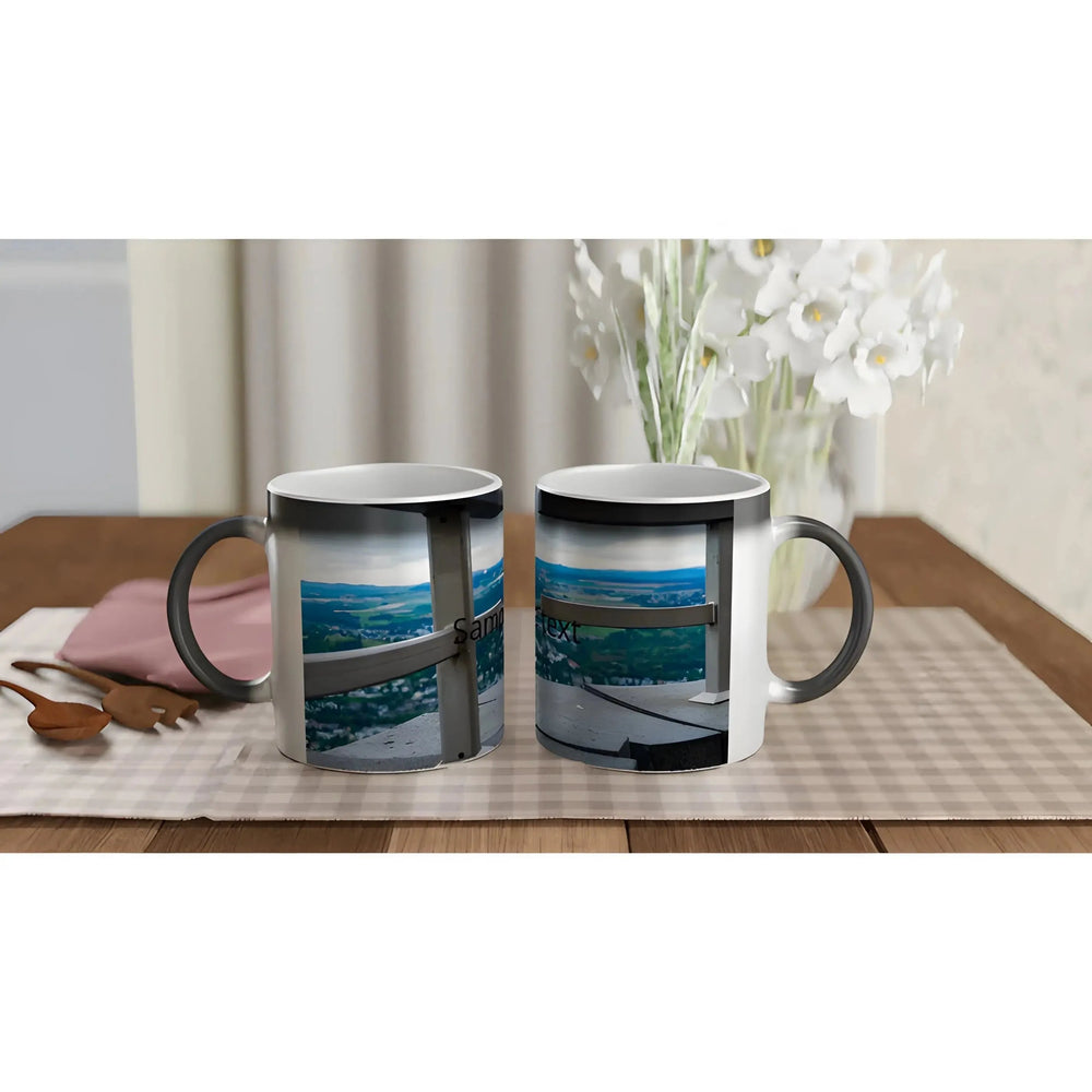 Personalized mugs featuring scenic landscape images, displayed on a checkered tablecloth alongside wooden utensils.