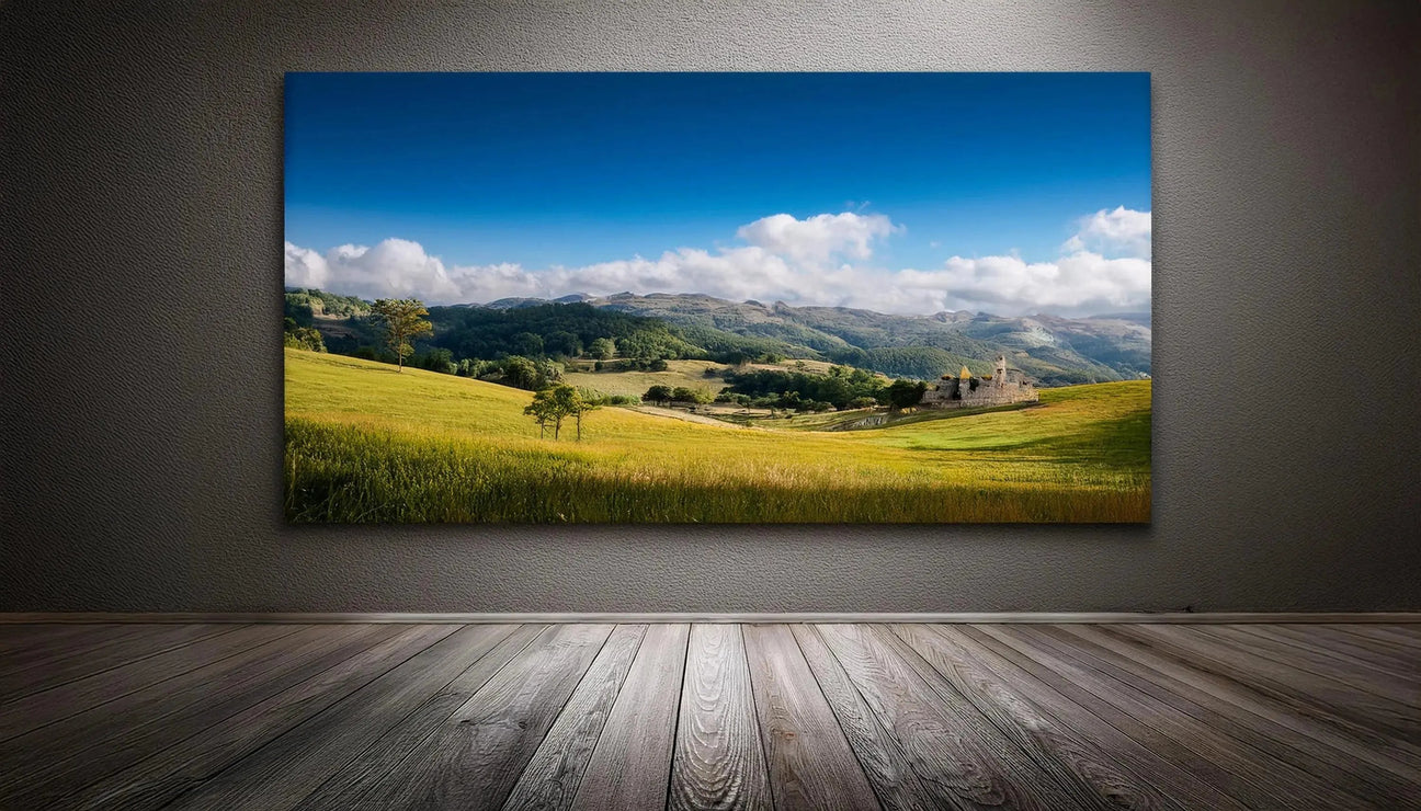 Vibrant landscape canvas print showcasing rolling green fields, a clear blue sky, and distant mountains, enhancing any room's decor.
